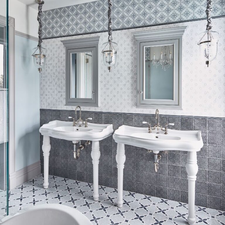 Dual sink vanity with sophisticated tile work by the best contractor in Monterey CA, Kasavan Construction.